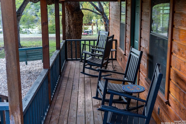 wooden terrace featuring a porch