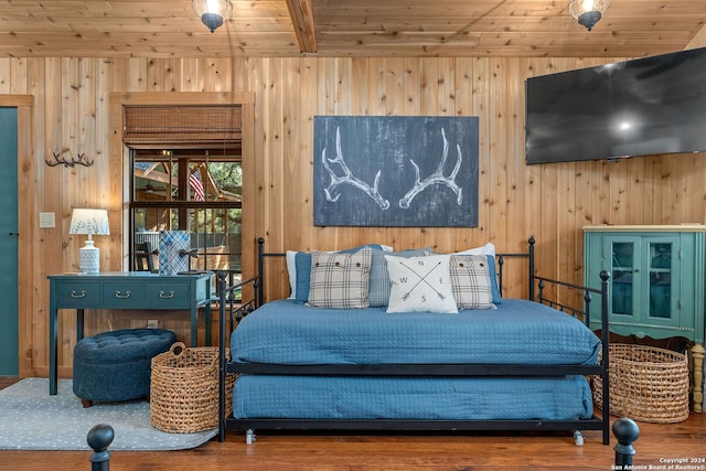 bedroom with wooden ceiling, beamed ceiling, wood walls, and wood finished floors