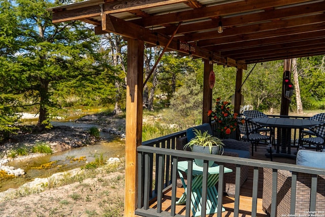 deck featuring outdoor dining area