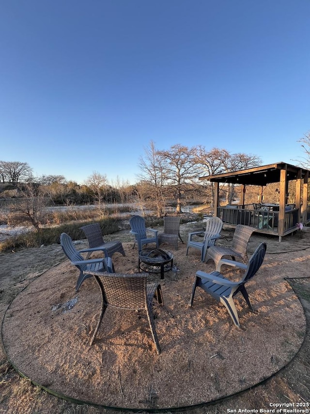 view of patio featuring a fire pit