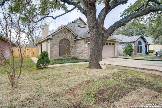 ranch-style home featuring a front lawn and a garage