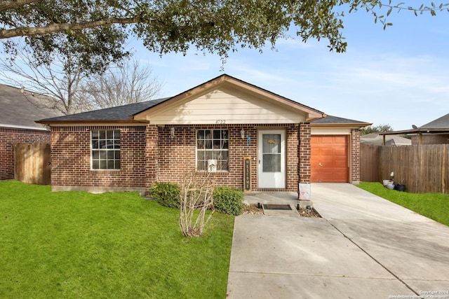 single story home with a front lawn and a garage