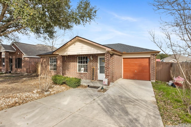 ranch-style house featuring a garage