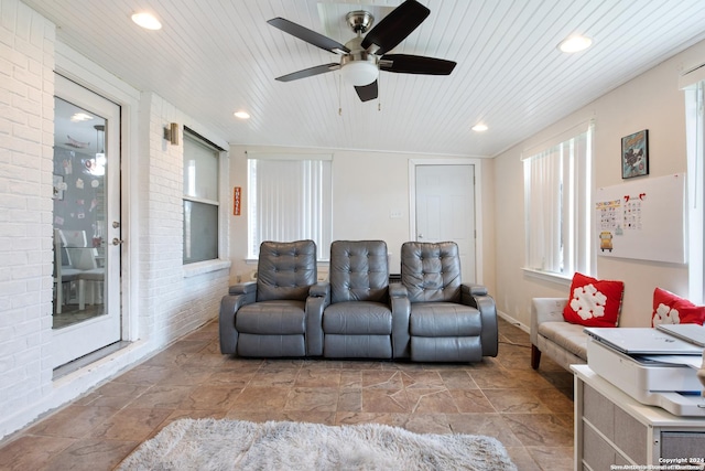 cinema featuring ceiling fan and wood ceiling