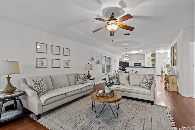 living room with ceiling fan and hardwood / wood-style flooring