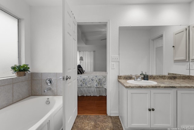 bathroom with a bath and vanity