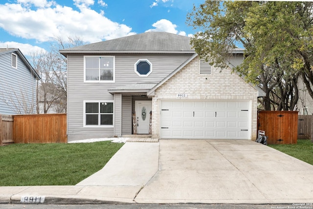 view of front property with a garage and a front lawn