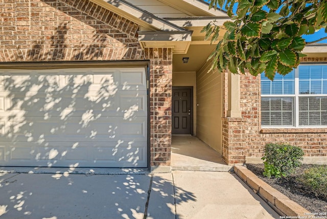 doorway to property featuring a garage