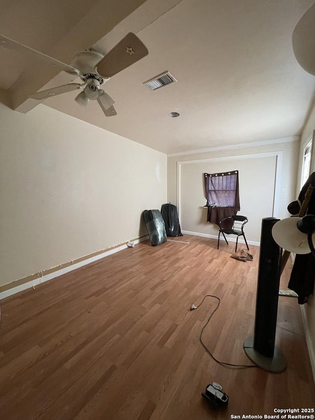 sitting room featuring ceiling fan and wood-type flooring