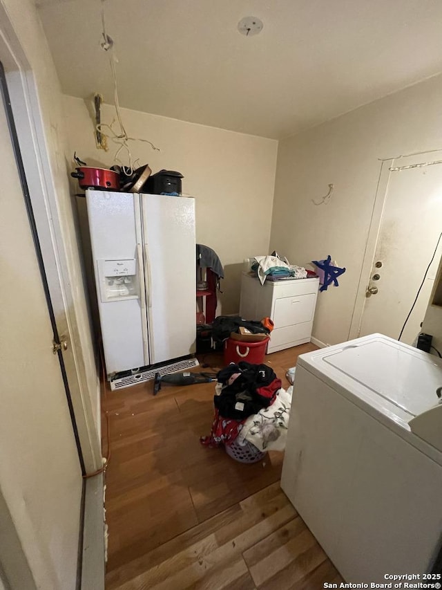 laundry room with light hardwood / wood-style flooring and washer / clothes dryer