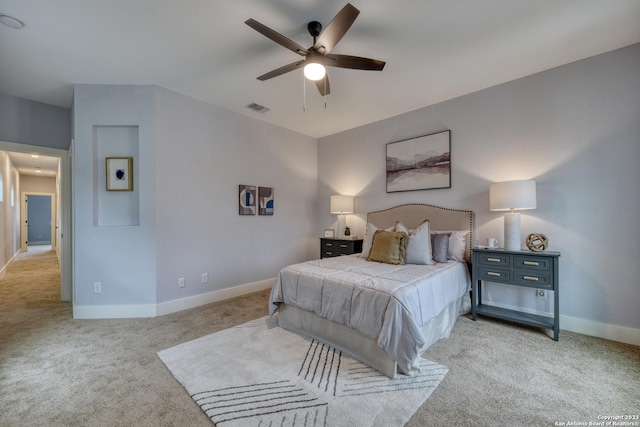 carpeted bedroom with ceiling fan