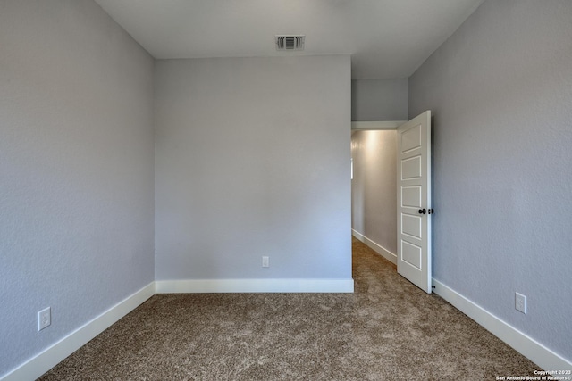 empty room with carpet flooring