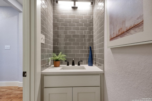 bathroom with backsplash and vanity