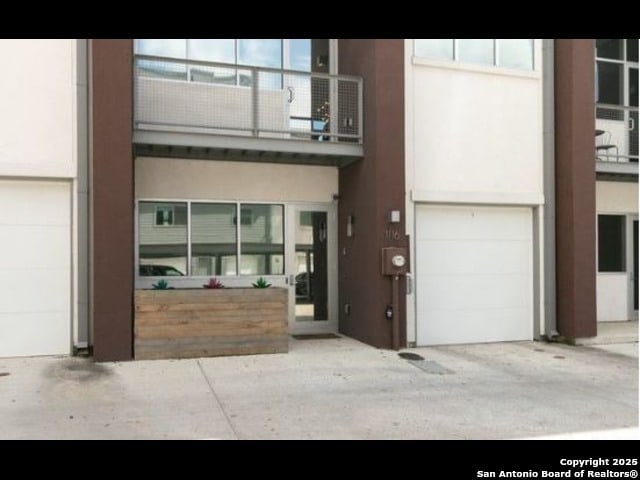 property entrance with a garage