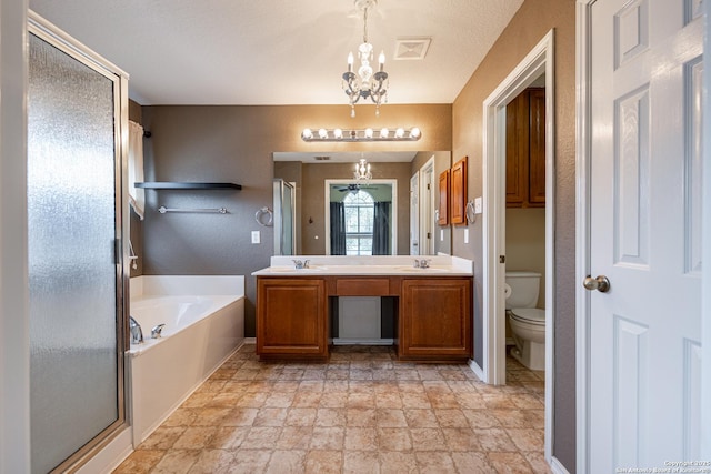 full bathroom with plus walk in shower, vanity, a notable chandelier, and toilet