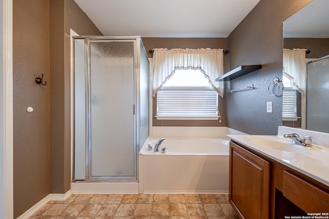 bathroom featuring vanity and plus walk in shower