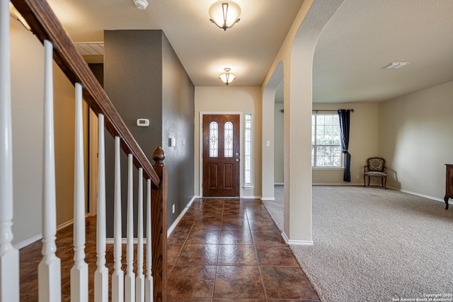 view of carpeted foyer