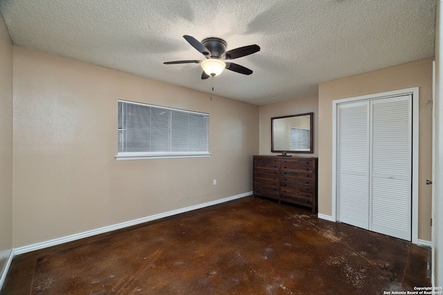 unfurnished bedroom featuring ceiling fan, a closet, and a textured ceiling