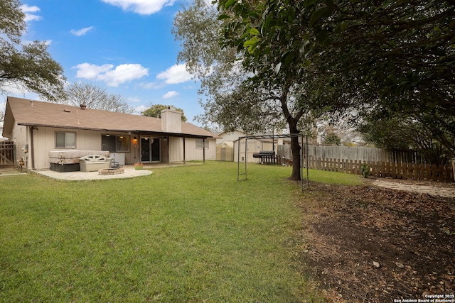 view of yard featuring a patio area and an outdoor fire pit