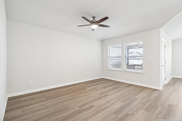 empty room with light wood-type flooring and ceiling fan