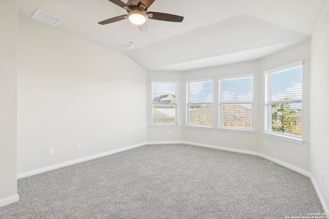 spare room featuring ceiling fan, carpet flooring, and lofted ceiling