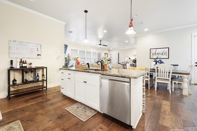 kitchen featuring white cabinets, dishwasher, hanging light fixtures, ceiling fan, and a center island with sink