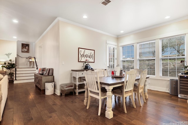 dining space with wine cooler, dark hardwood / wood-style floors, and crown molding