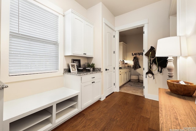 hall with dark wood-type flooring