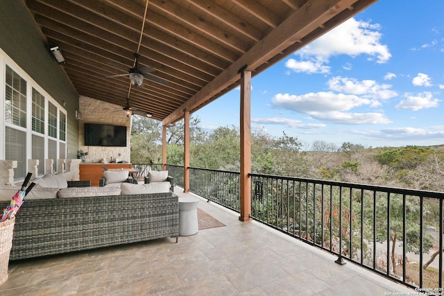 view of patio / terrace with ceiling fan and an outdoor living space