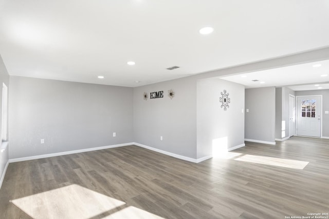 empty room with hardwood / wood-style flooring