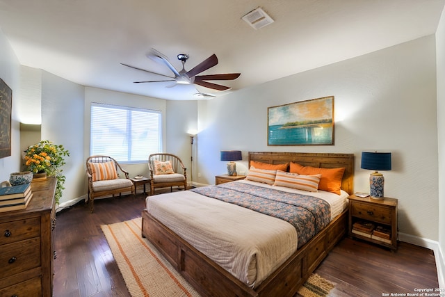 bedroom with ceiling fan and dark wood-type flooring