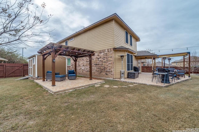 rear view of property featuring outdoor lounge area, a patio, a lawn, and a pergola