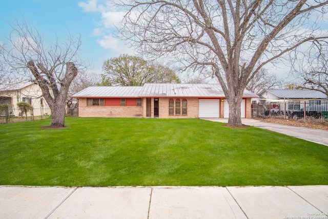 ranch-style home featuring a front lawn and a garage