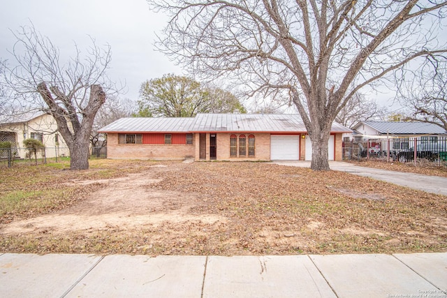 ranch-style home featuring a garage