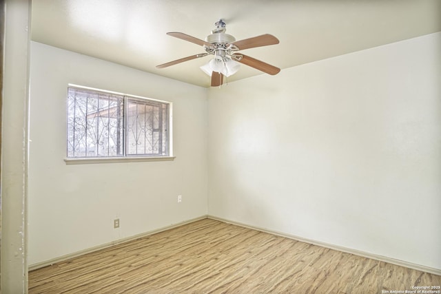 spare room with ceiling fan and light hardwood / wood-style flooring