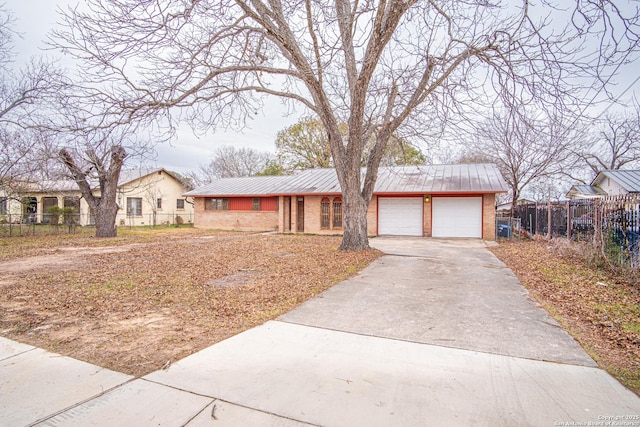 ranch-style home featuring a garage