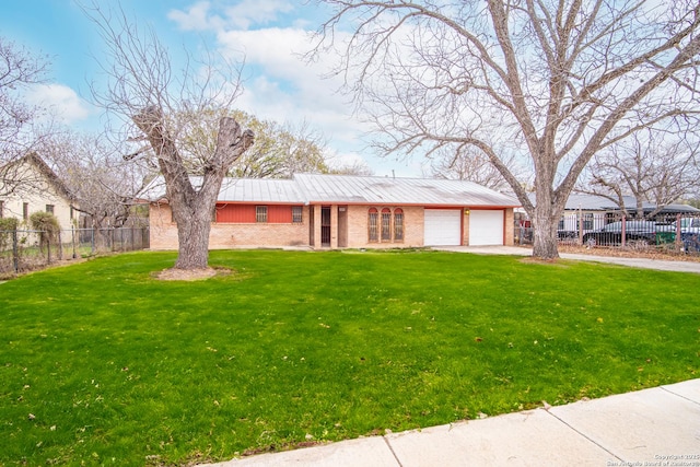 single story home with a garage and a front yard