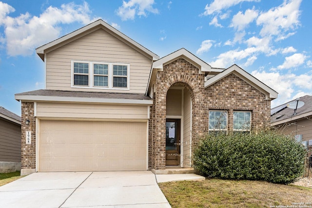 view of front of property with a garage