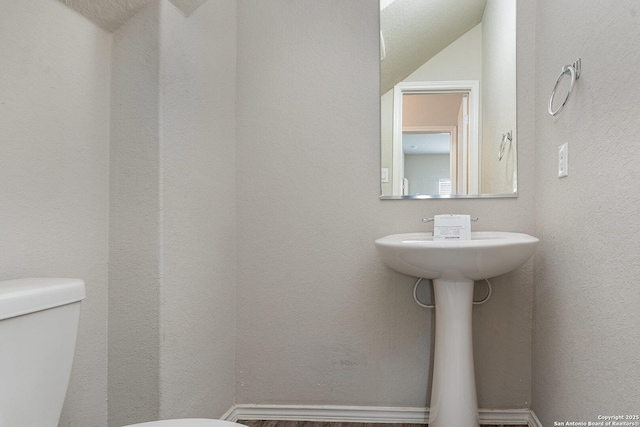 bathroom featuring toilet