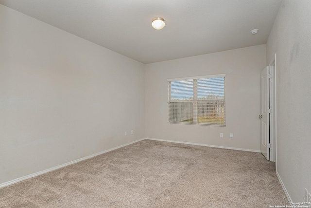 empty room with light colored carpet