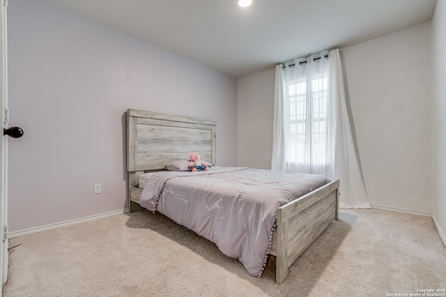 bedroom featuring light carpet