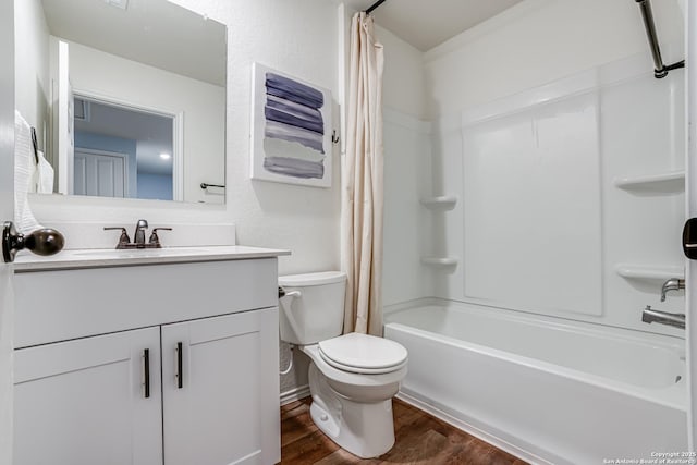 full bathroom featuring hardwood / wood-style floors, toilet, vanity, and shower / bath combo