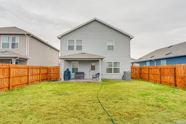 back of property featuring a patio area, central air condition unit, and a lawn