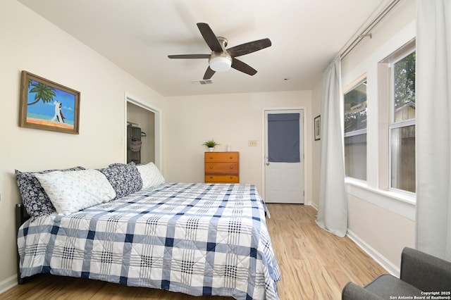 bedroom featuring ceiling fan and light hardwood / wood-style flooring