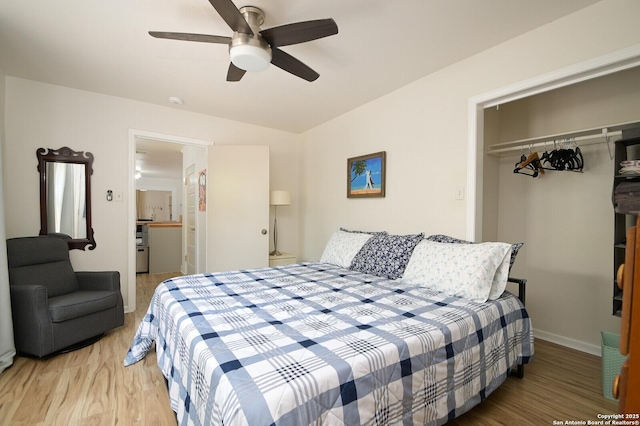 bedroom with ceiling fan, hardwood / wood-style flooring, and a closet