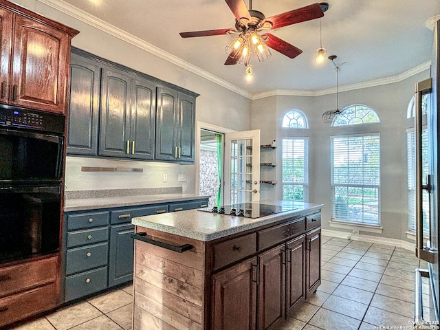 kitchen with black appliances, light tile patterned flooring, ornamental molding, and a kitchen island