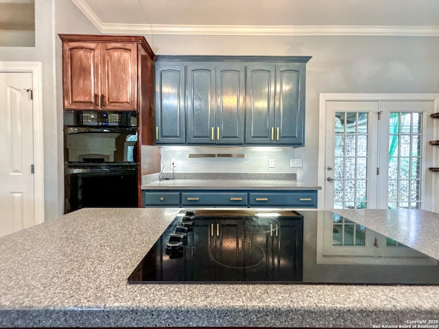 kitchen with ornamental molding and black appliances