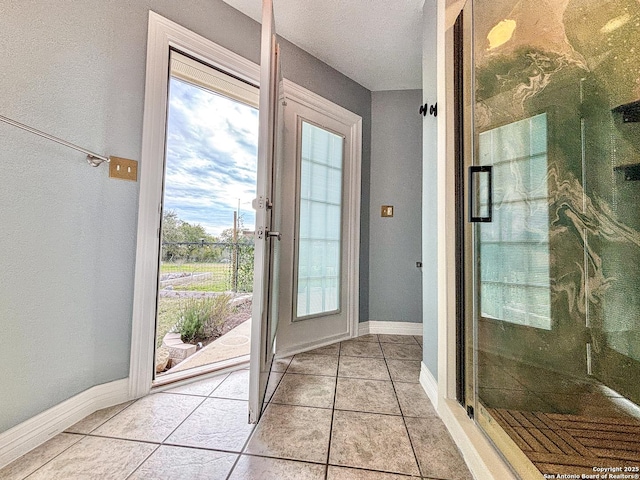 doorway featuring light tile patterned floors