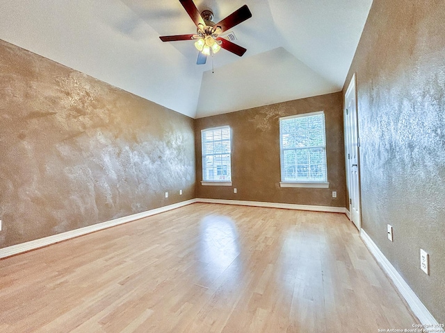 unfurnished room featuring vaulted ceiling, ceiling fan, and light hardwood / wood-style flooring