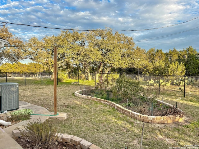 view of yard featuring central AC